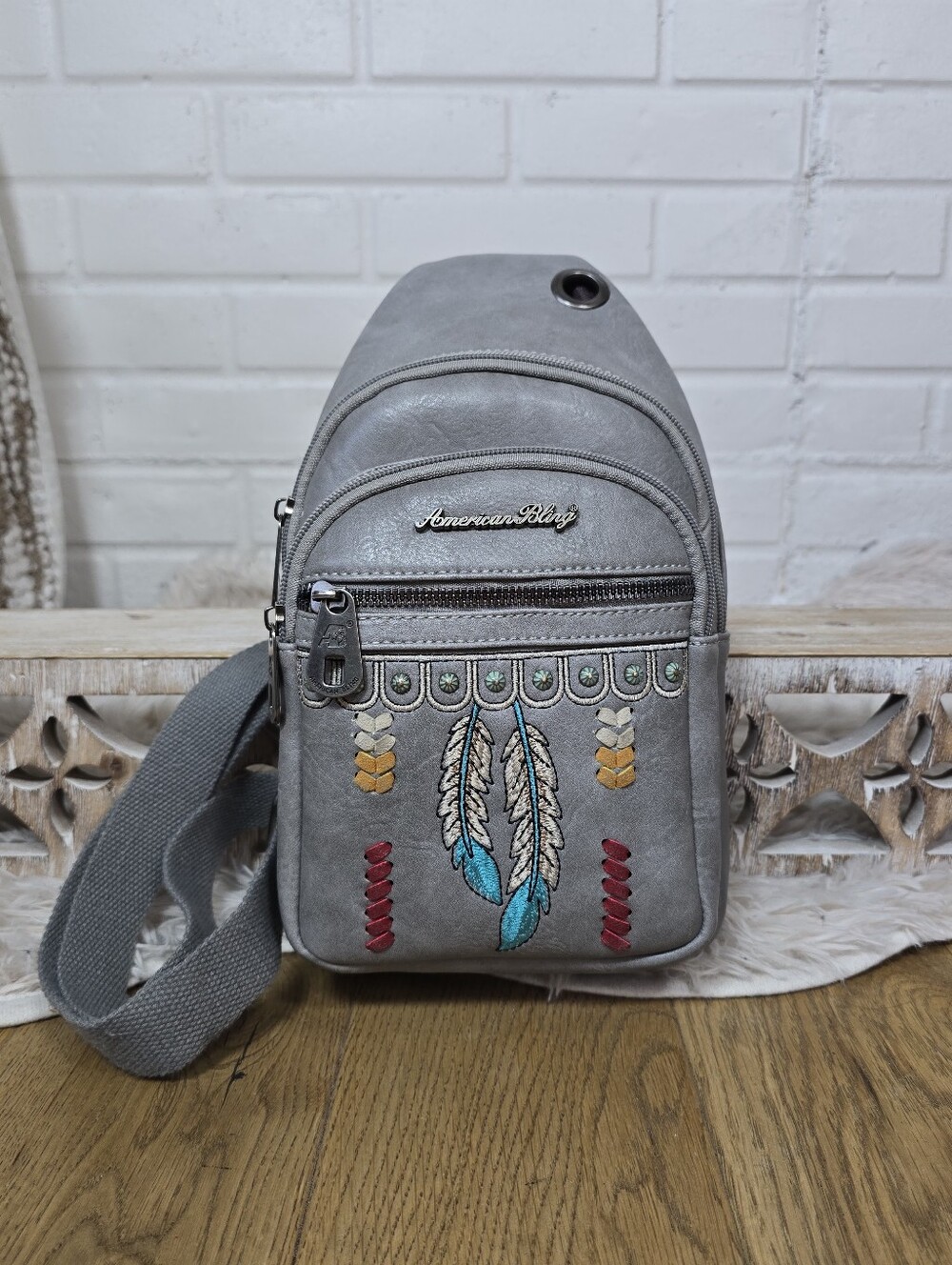American Bling Gray Crossbody with Embroidered Feather Accents